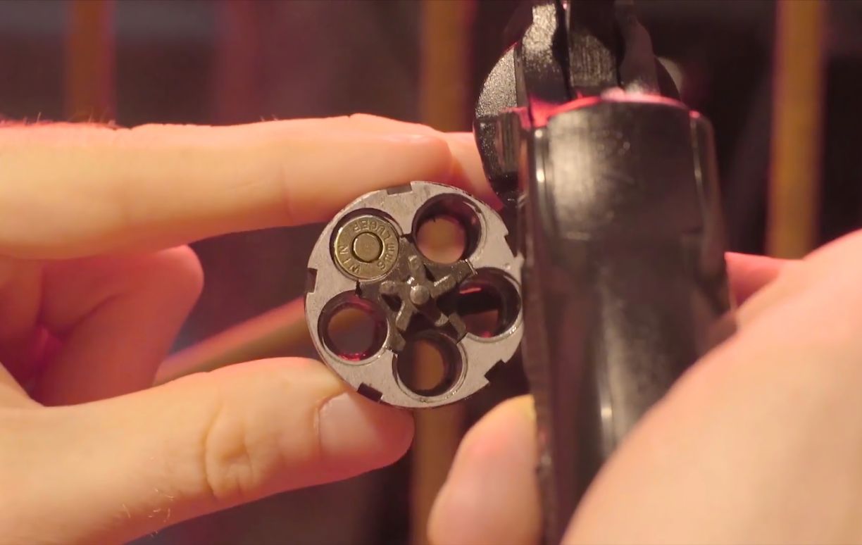 Looking down the cylinder of a revolver